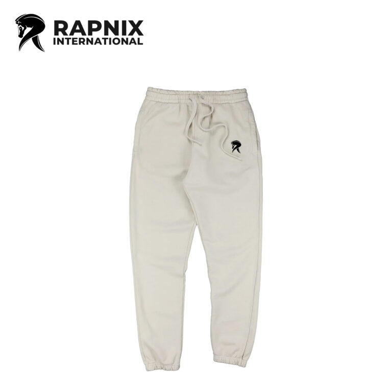 Heavyweight unisex fleece sweatpants in off-white with elastic waistband, side pockets, and self-fabric cuffs